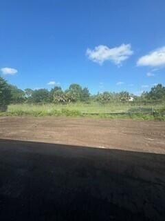 view of yard with a rural view