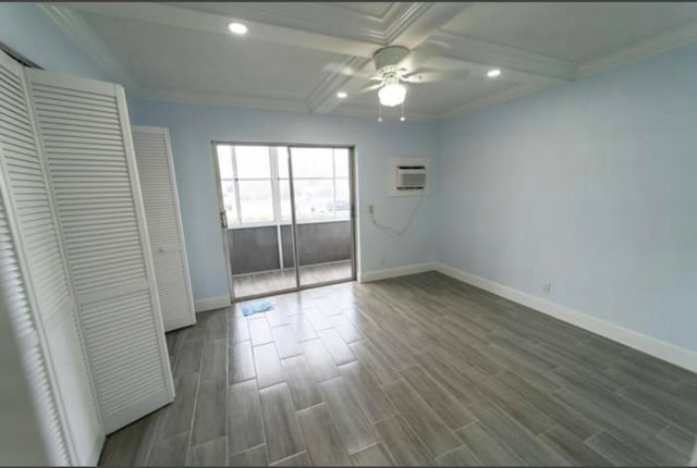 unfurnished bedroom featuring ceiling fan, beamed ceiling, dark wood-type flooring, and crown molding