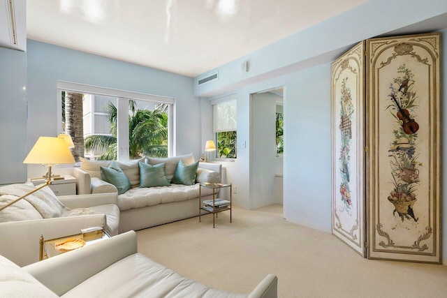 carpeted living room featuring visible vents