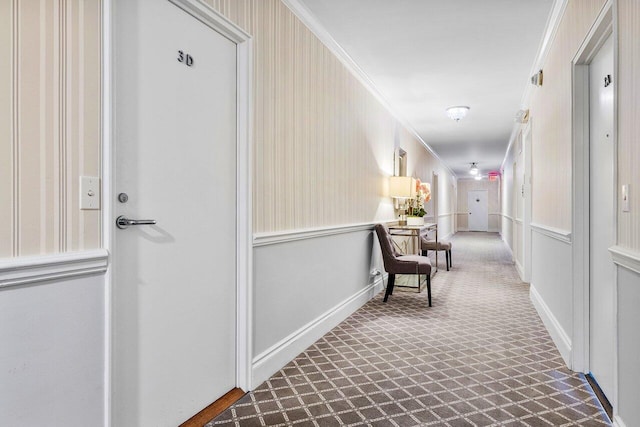 hallway featuring ornamental molding