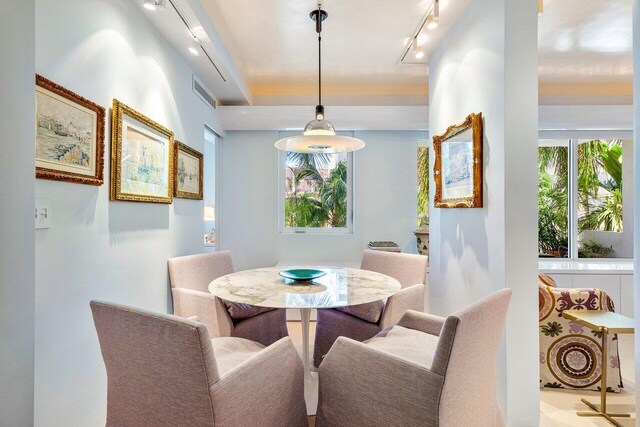 dining room featuring track lighting