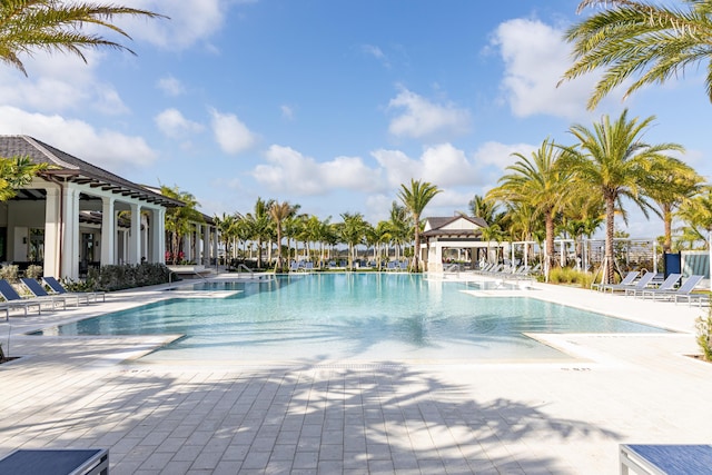 community pool with a patio area