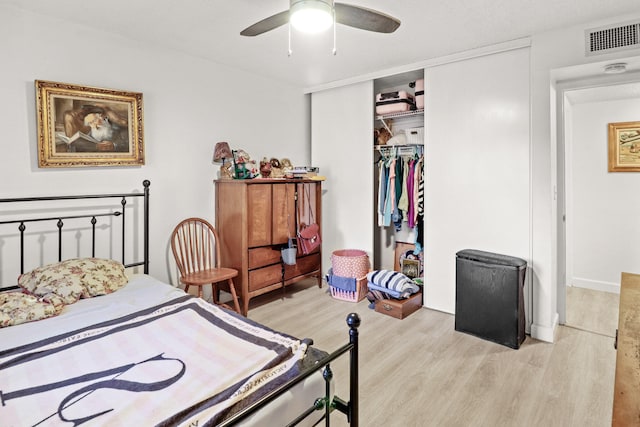 bedroom featuring a closet, ceiling fan, and light hardwood / wood-style flooring