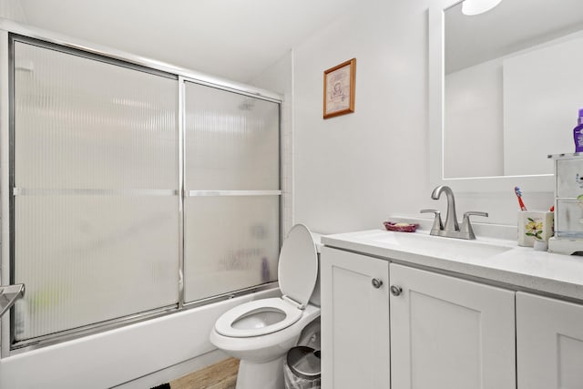 full bathroom with shower / bath combination with glass door, vanity, toilet, and wood-type flooring