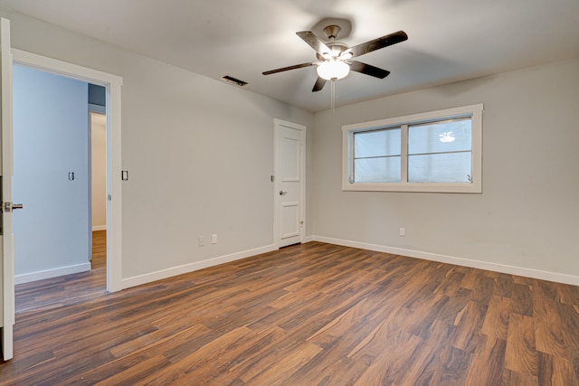 unfurnished bedroom featuring dark hardwood / wood-style floors and ceiling fan