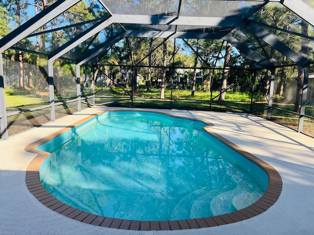 view of pool with a lanai