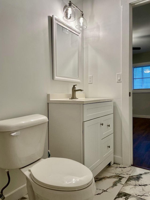 bathroom with vanity and toilet