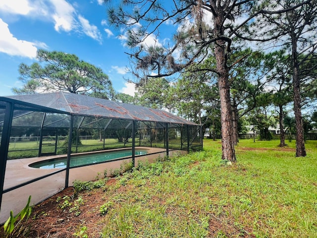 view of yard featuring a lanai