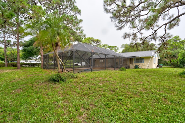 view of yard with glass enclosure