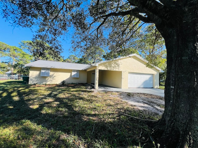 ranch-style house with a garage and a front lawn