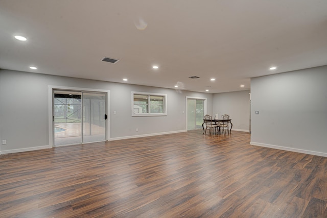 spare room with dark hardwood / wood-style flooring