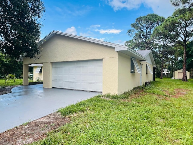 view of side of home featuring a lawn and a garage