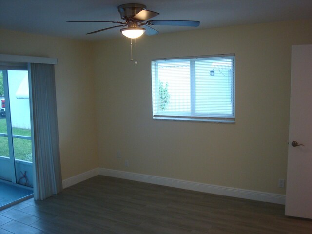 spare room featuring hardwood / wood-style flooring and ceiling fan