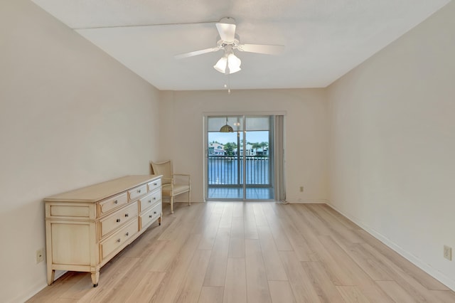 spare room with ceiling fan and light hardwood / wood-style floors