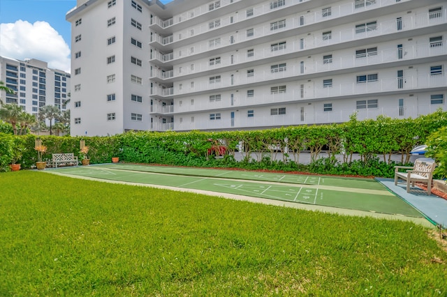 surrounding community featuring a lawn