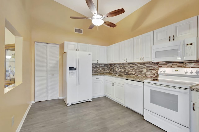 kitchen featuring ceiling fan, decorative backsplash, light hardwood / wood-style flooring, white cabinetry, and white appliances