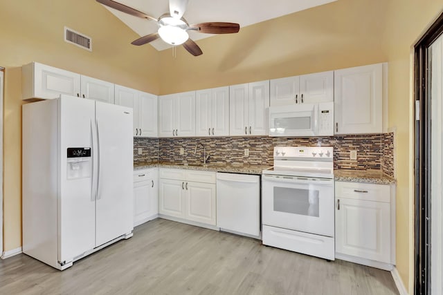 kitchen with white cabinetry, tasteful backsplash, light hardwood / wood-style flooring, and white appliances