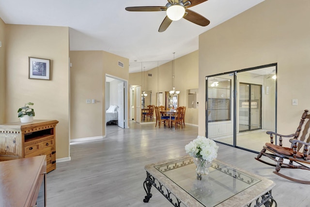 living room featuring ceiling fan and light wood-type flooring