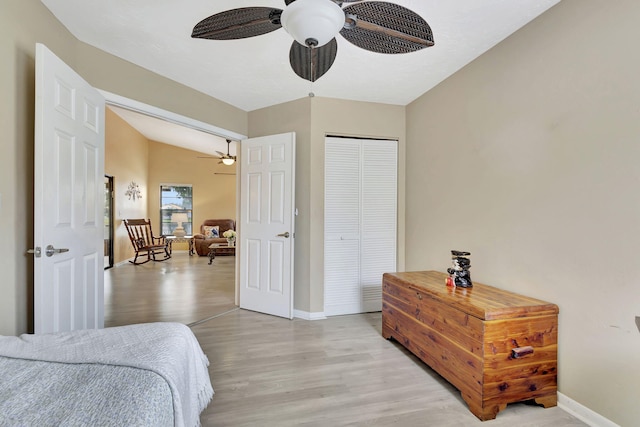 bedroom with a closet, ceiling fan, and light wood-type flooring