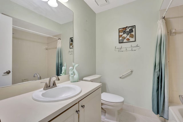 full bathroom with tile patterned flooring, shower / tub combo with curtain, toilet, and vanity