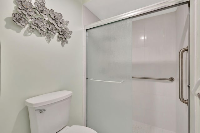 bathroom with toilet and walk in shower