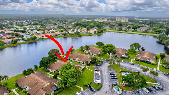 birds eye view of property with a water view