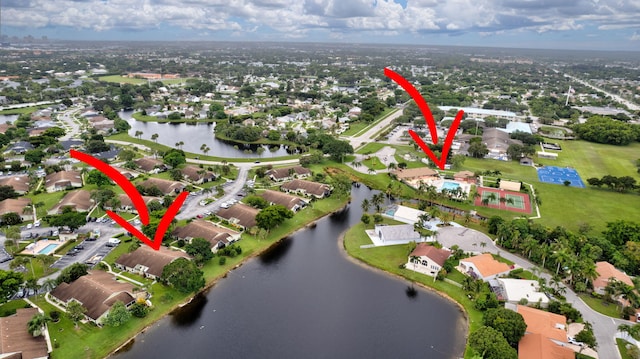 birds eye view of property featuring a water view