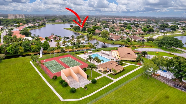 birds eye view of property with a water view