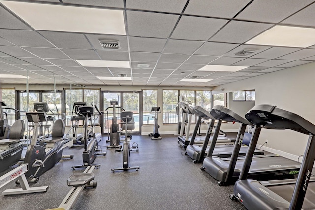 workout area featuring a drop ceiling