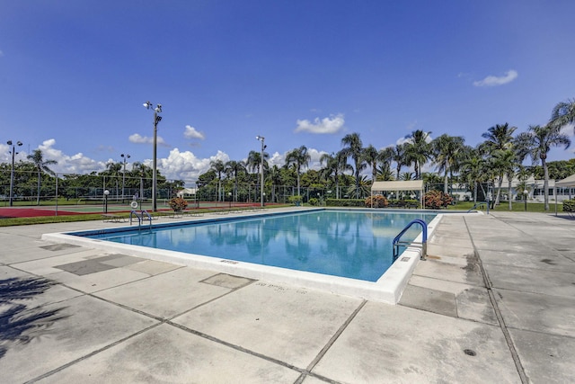 view of swimming pool featuring a patio