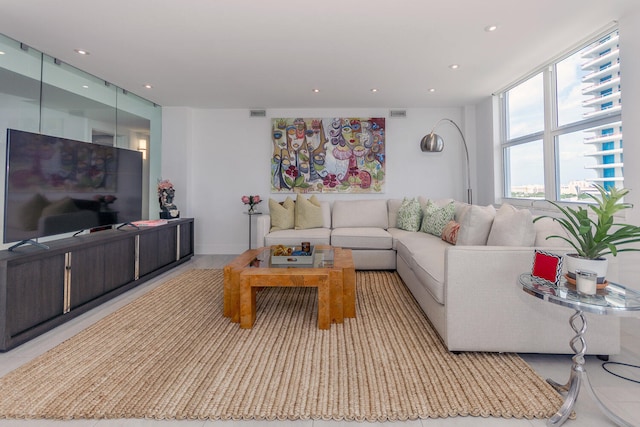 living room with recessed lighting and visible vents