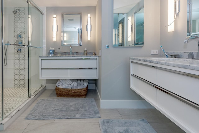 bathroom with tile patterned floors, an enclosed shower, and vanity