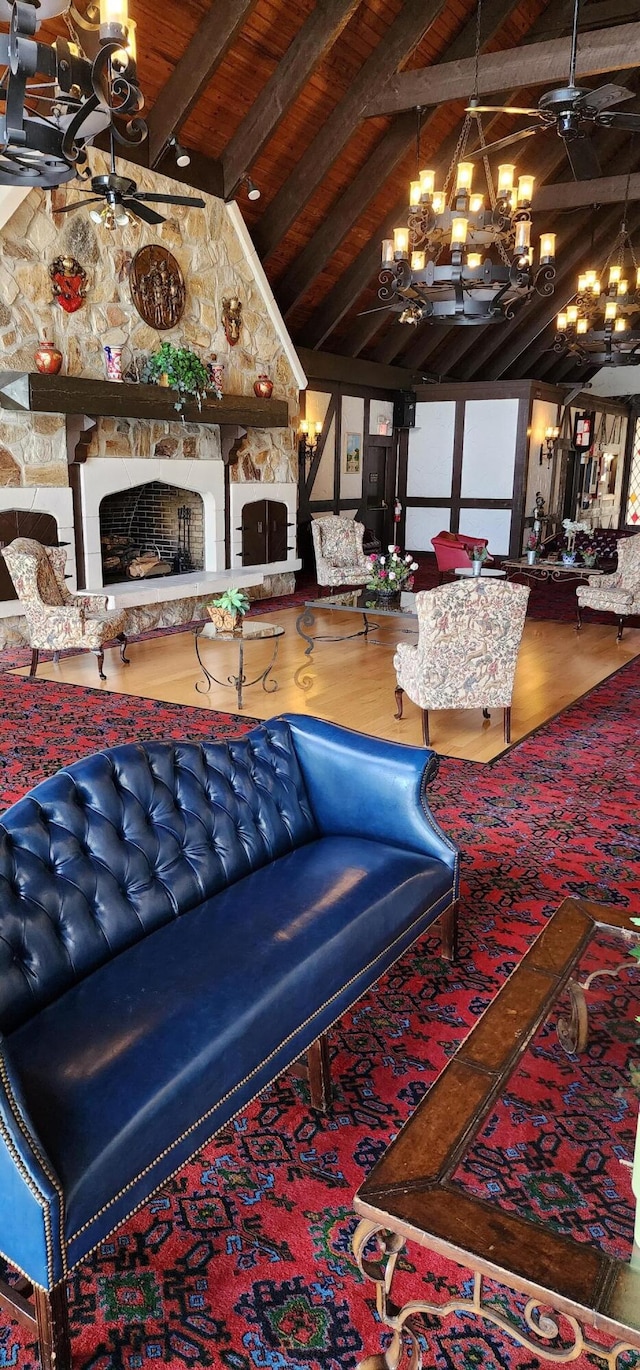 interior space with beam ceiling, an inviting chandelier, a fireplace, wood-type flooring, and wooden ceiling