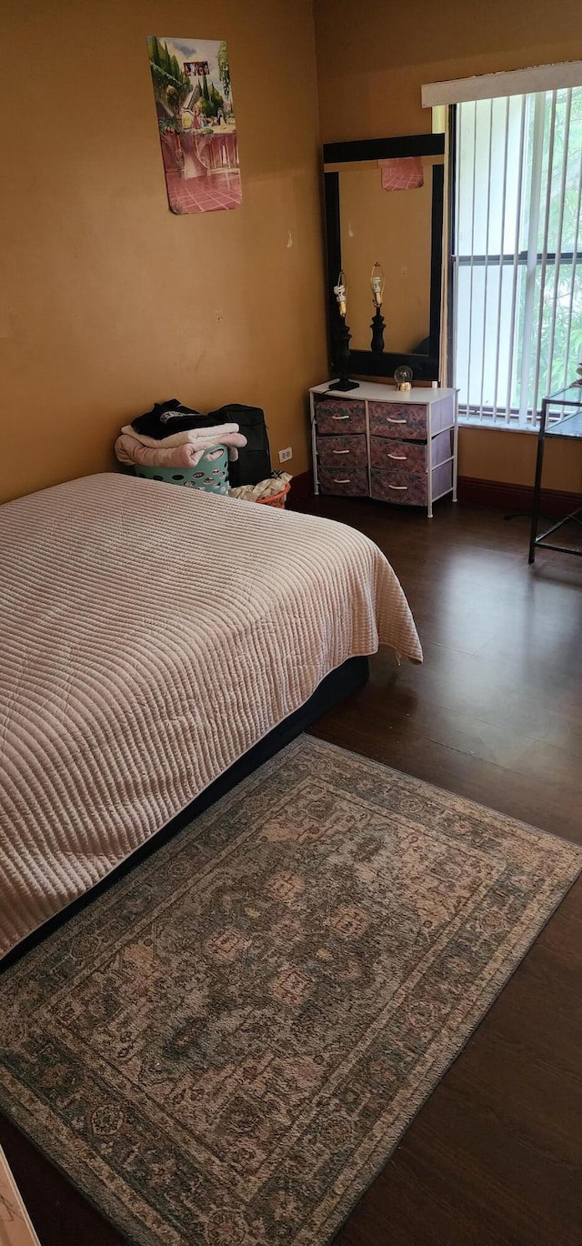 bedroom featuring dark hardwood / wood-style floors