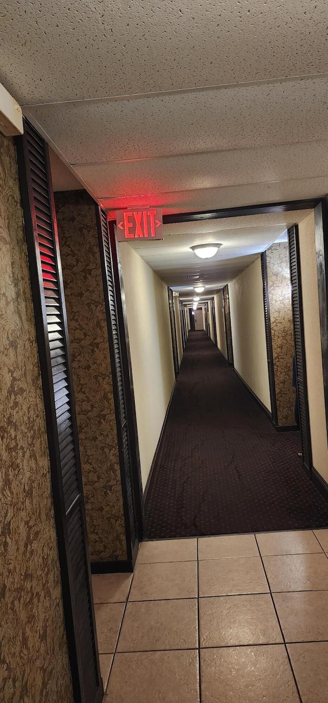 corridor featuring light tile patterned floors