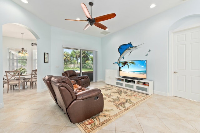 living room with ceiling fan and light tile patterned flooring