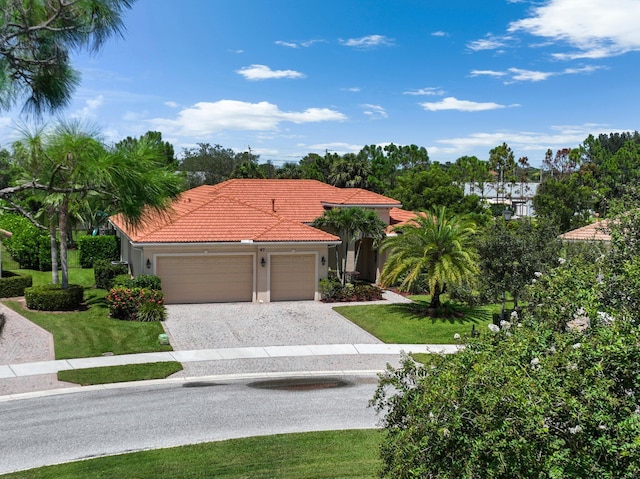 mediterranean / spanish-style home featuring a garage, a front yard, decorative driveway, and a tile roof