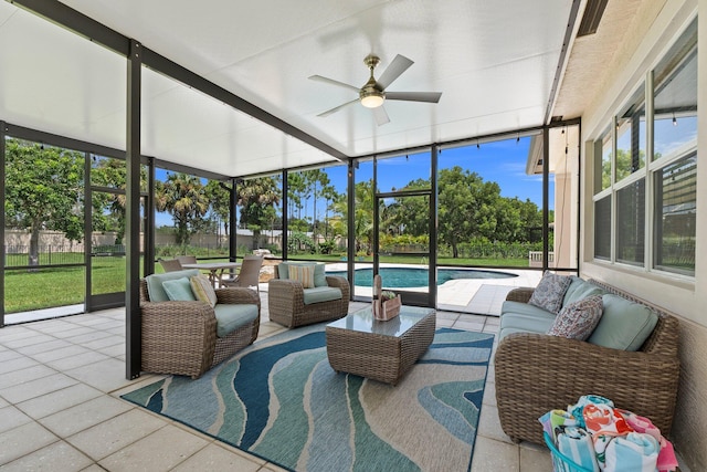 sunroom / solarium featuring ceiling fan