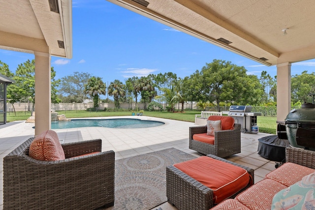 view of swimming pool with a lawn, an outdoor living space, a patio area, and grilling area