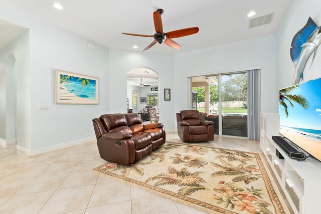 living room featuring ceiling fan and light tile patterned floors