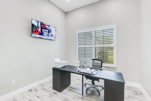 home office featuring light hardwood / wood-style flooring