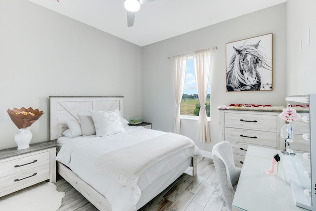 bedroom featuring ceiling fan and light hardwood / wood-style flooring