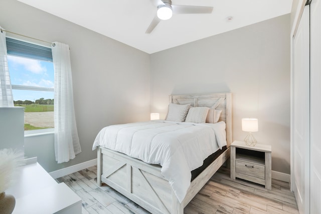 bedroom featuring light wood-type flooring and ceiling fan