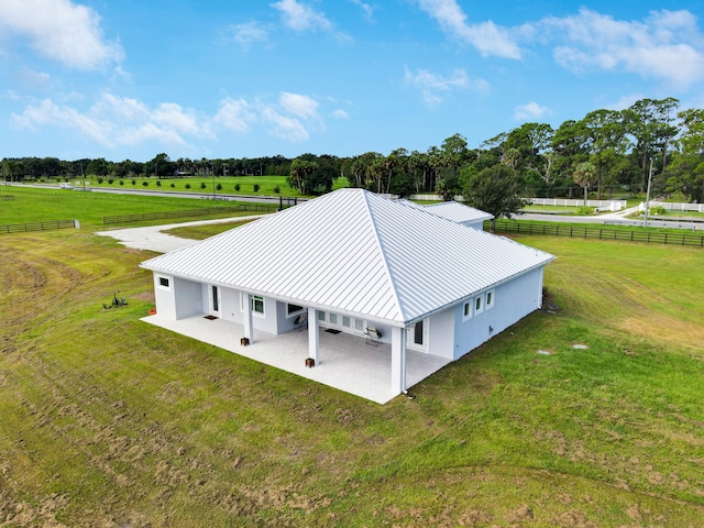 birds eye view of property with a rural view