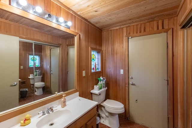 bathroom with wooden ceiling, vanity, toilet, and tile patterned floors