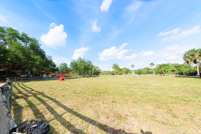 view of yard with a rural view