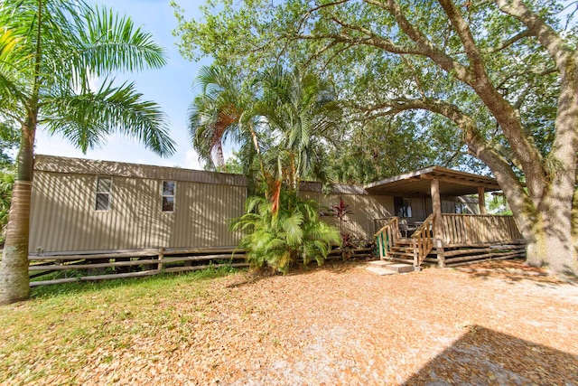 view of yard featuring a wooden deck