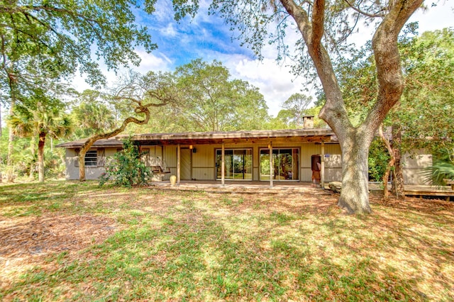 rear view of property featuring a patio