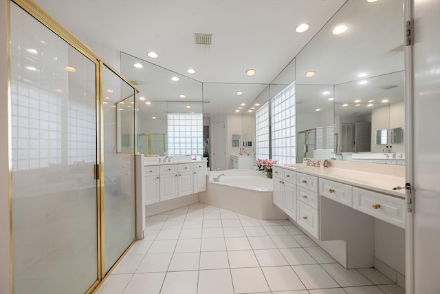 bathroom with vanity, shower with separate bathtub, and tile patterned floors