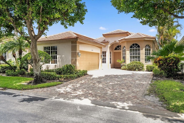 mediterranean / spanish-style house featuring a garage